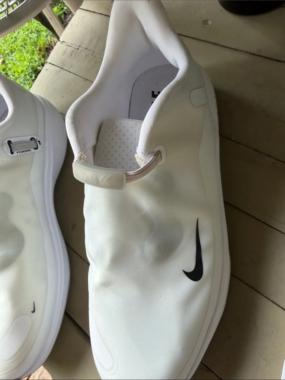 Nike Men’s White Slip-On Sneakers with Black Swoosh